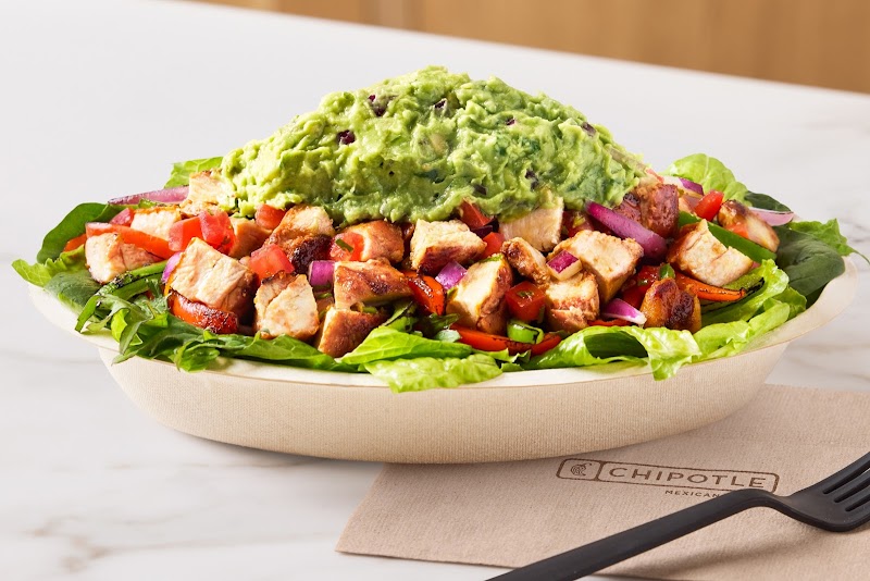 Chipotle burrito bowl with rice, beans, and guacamole